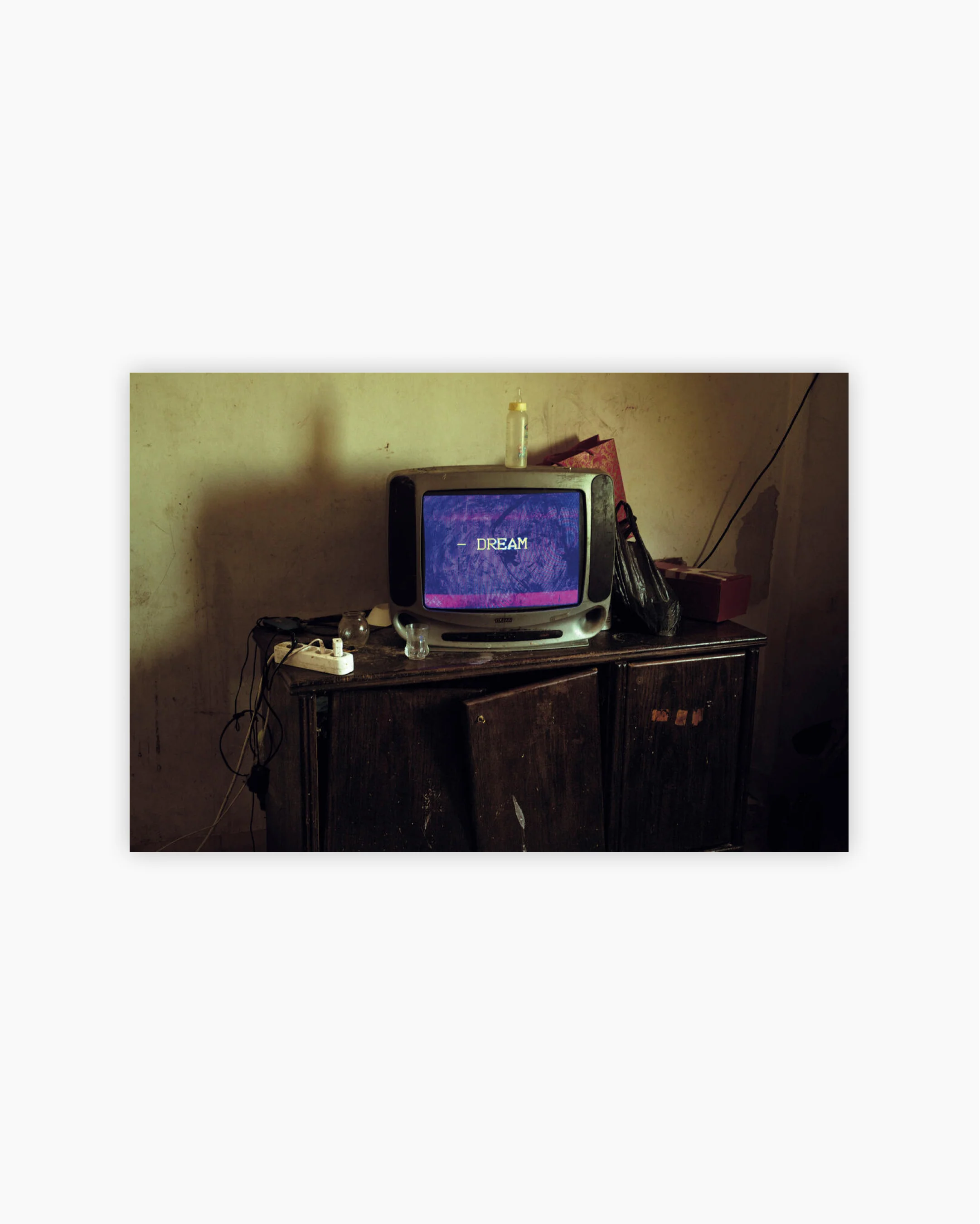 Fine Print: A TV in the home of a refugee family from Iraq. Amman, Jordan, 2021