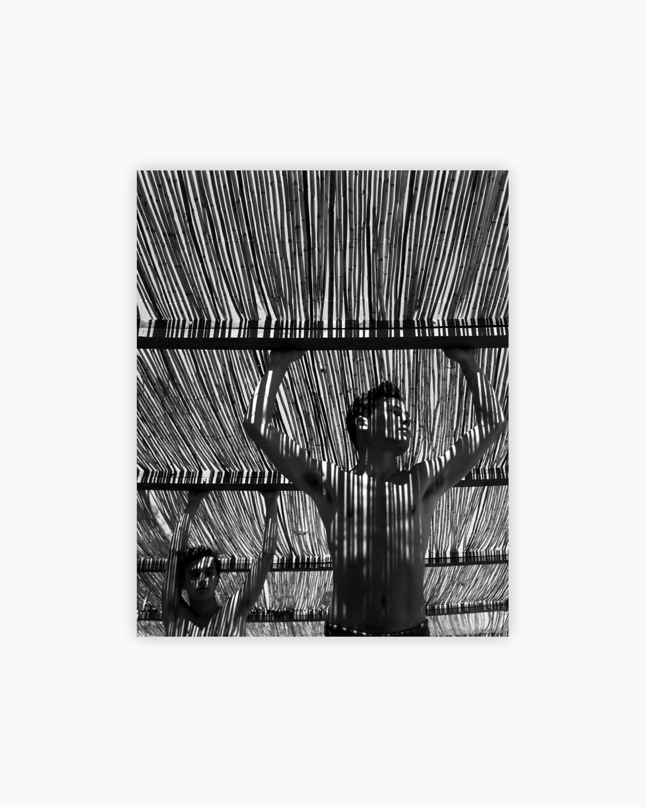 Fine Print: Young men under a reed roof. Andalucia, Spain, 1951